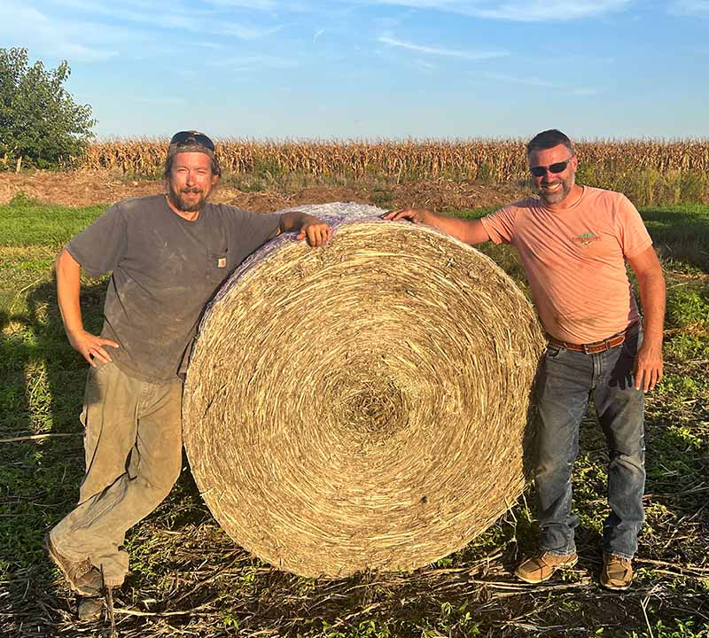 farmers with bale